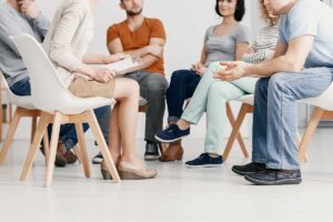 a group discusses the question "what is group therapy?"
