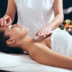 a person getting a massage enjoys the benefits of holistic therapy