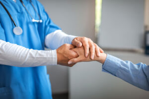 a doctor comforts a patient after they ask what is outpatient treatment