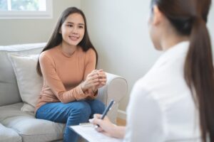 eager young woman asks female therapist what does php stand for?