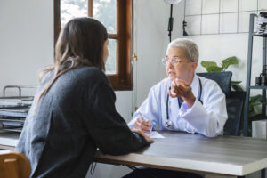 A doctor talking to a patient about how to taper off trazodone.
