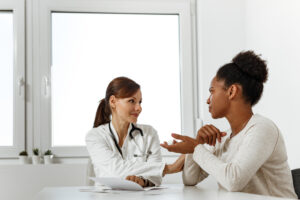 A woman talking to a doctor about a buspirone taper.